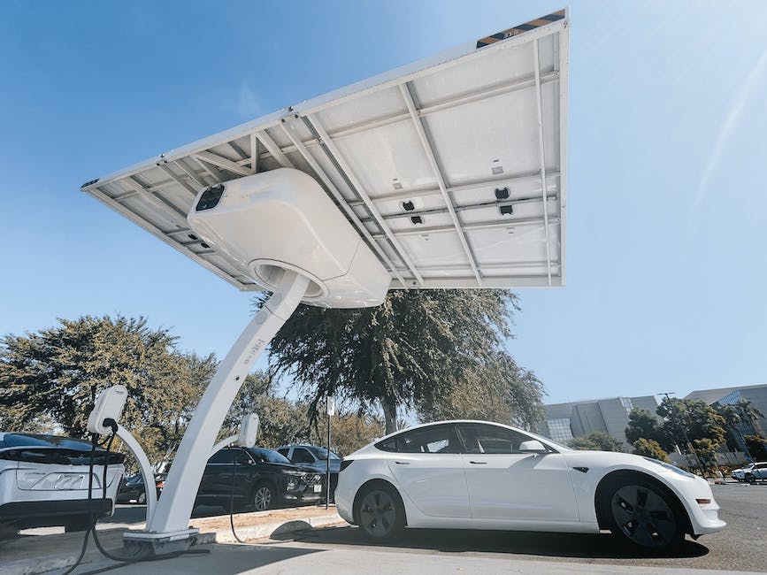 A close-up image of a Tesla car battery showing the intricate wiring and components.