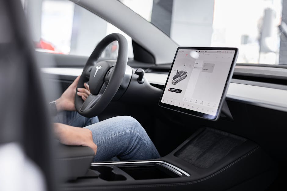 A Tesla car dashboard with various infotainment features displayed.